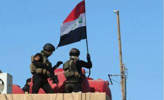 اهتزاز پرچم عراق در فلوجه پس از سه سال